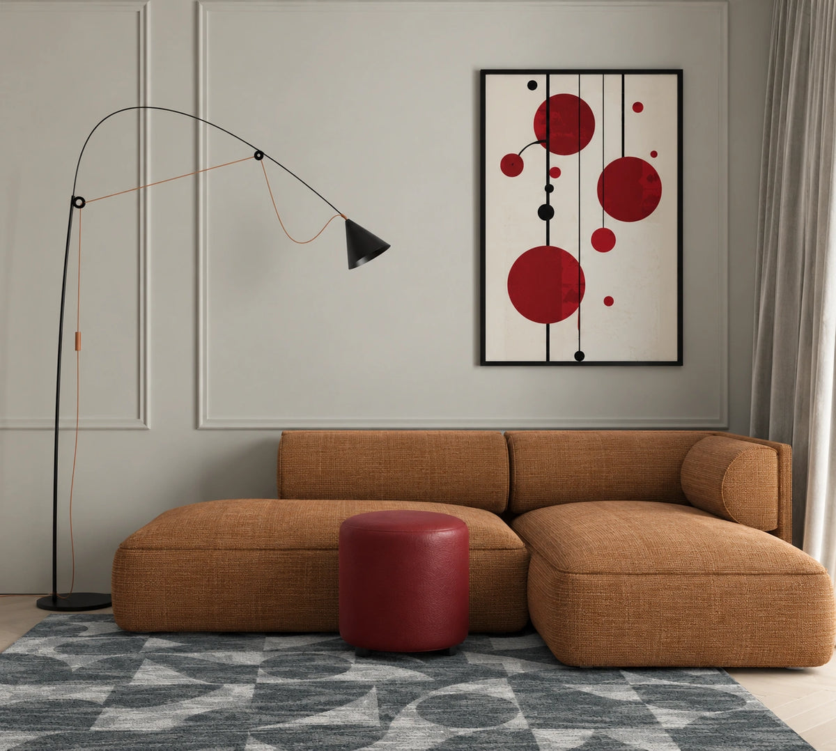 Contemporary living room with a caramel brown sectional sofa, red cylindrical ottoman, black sculptural floor lamp, geometric gray area rug, and abstract red and black wall art on a paneled wall.